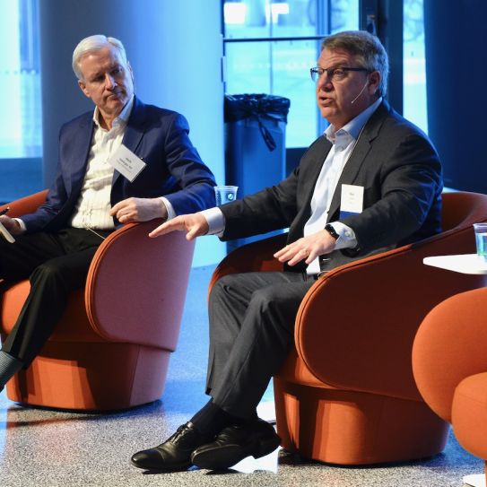 Moderator Mark Gallogly ’86, cofounder of Three Cairns Group, and Rich Lesser, global chair of the Boston Consulting Group, speak at the 2022 Climate Business & Investment Conference at Columbia Business School.