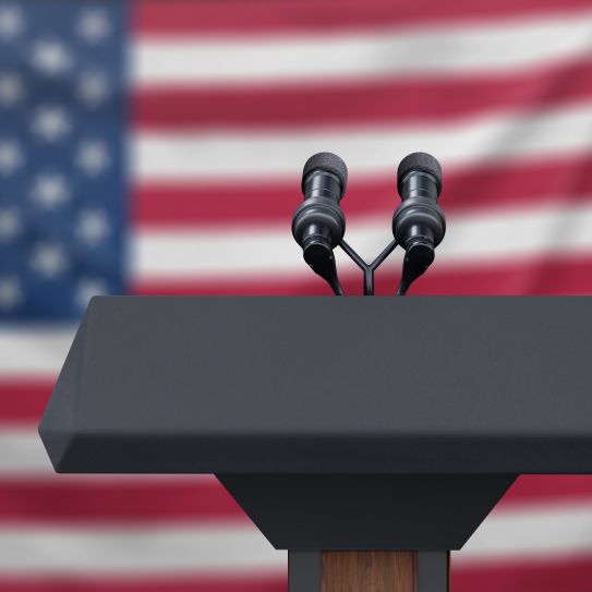 microphone on podium in front of American flag