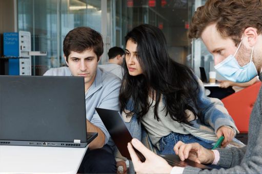 students checking their laptops