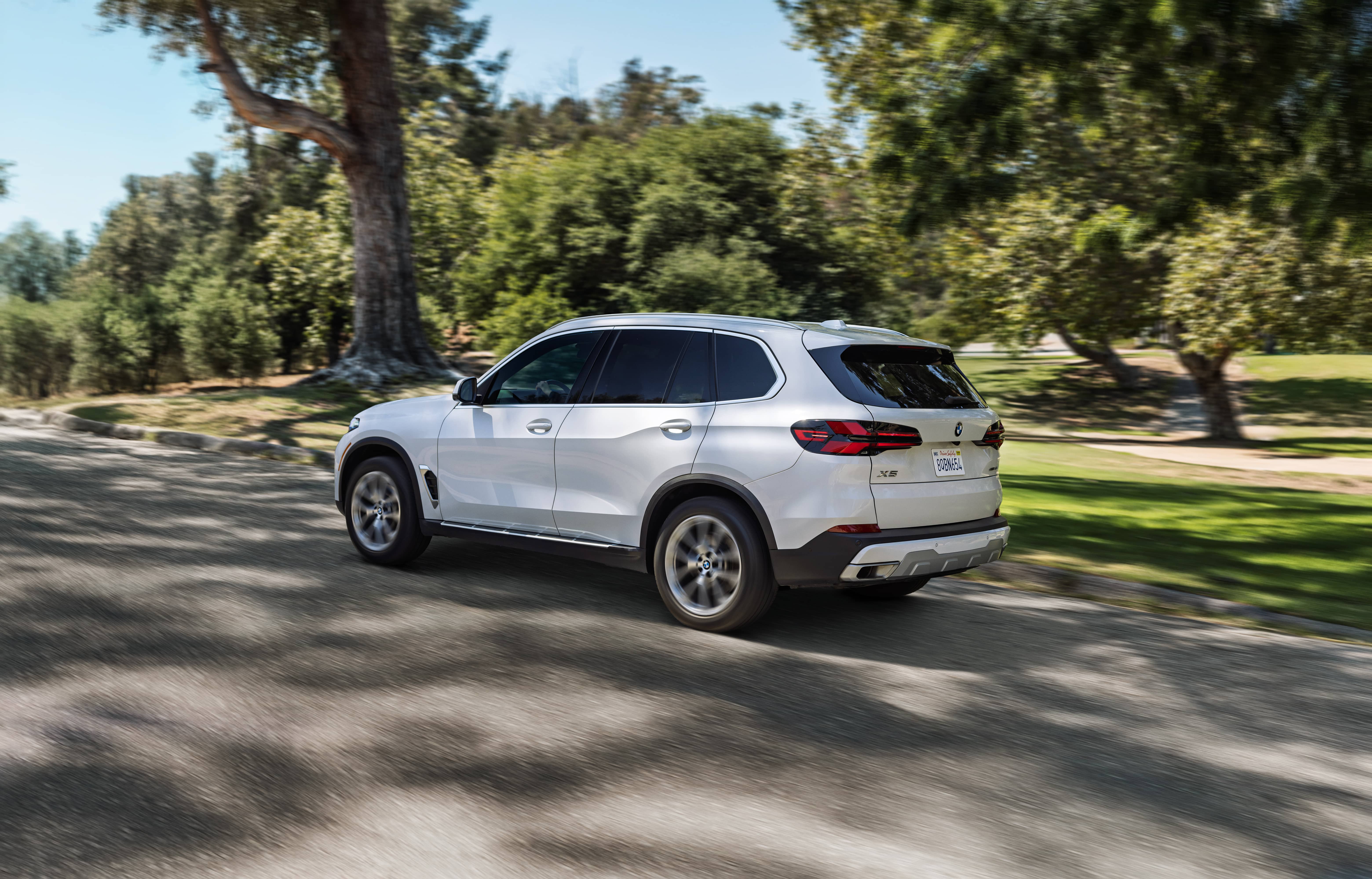 BMW X5 driving outdoors