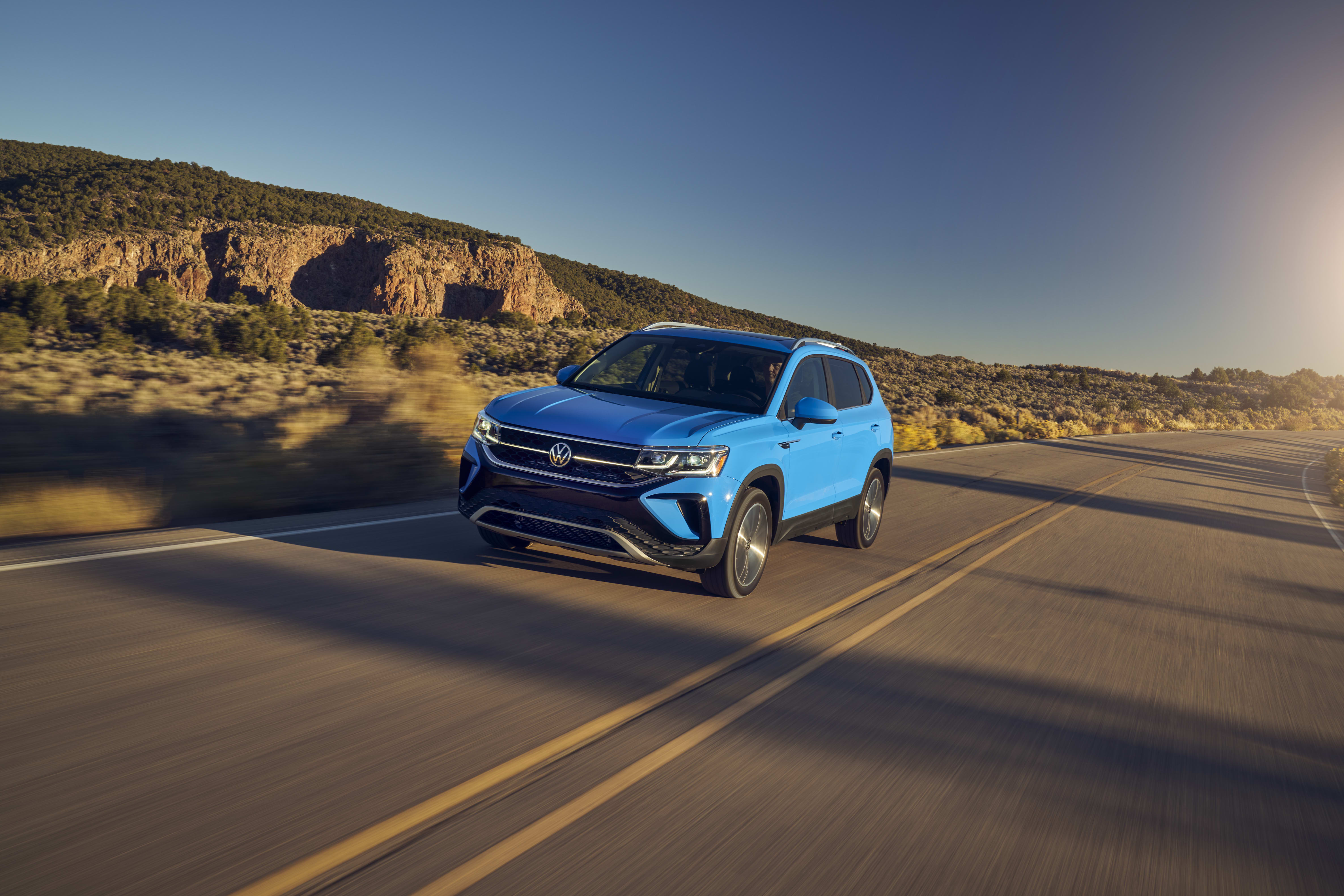 Blue 2026 VW Taos driving outside