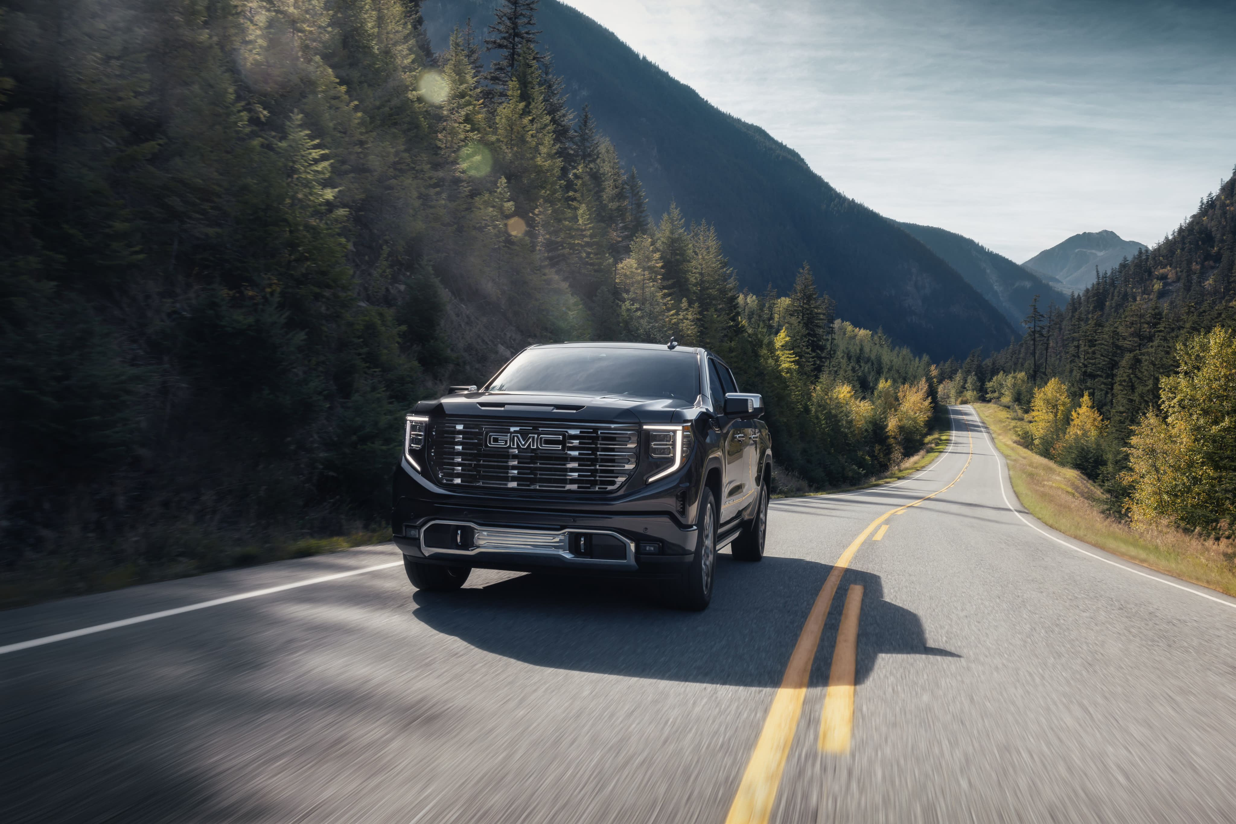 2026 GMC Sierra driving outdoors