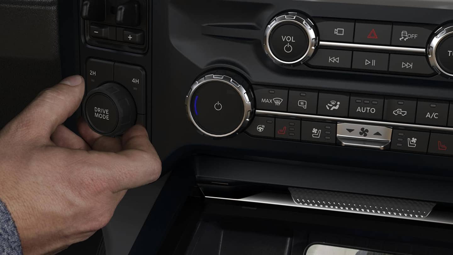 man touching knob on interior of super duty