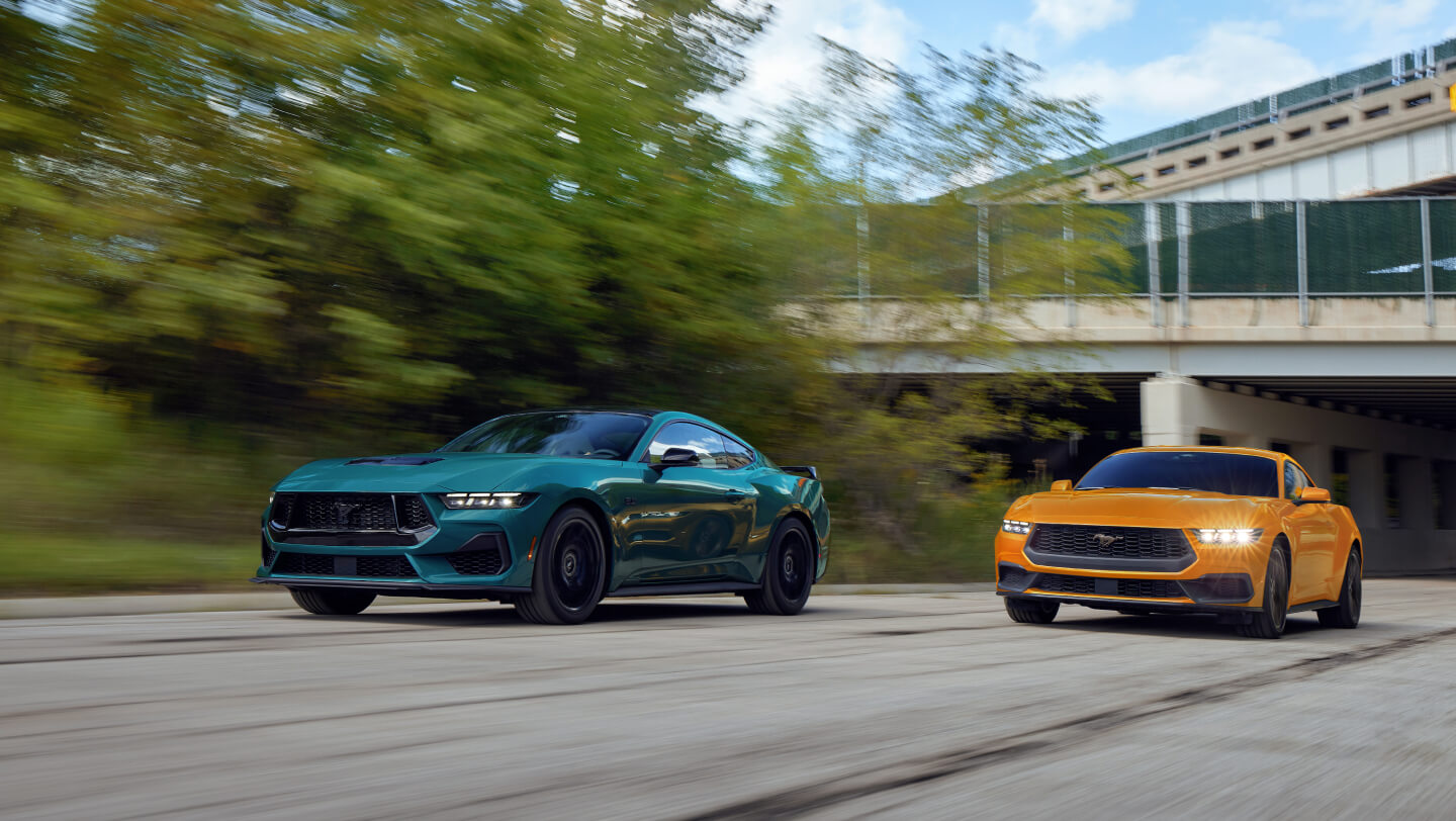 exterior two 2026 ford mustangs driving side by side