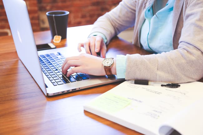 a developer sitting at a desk writing code