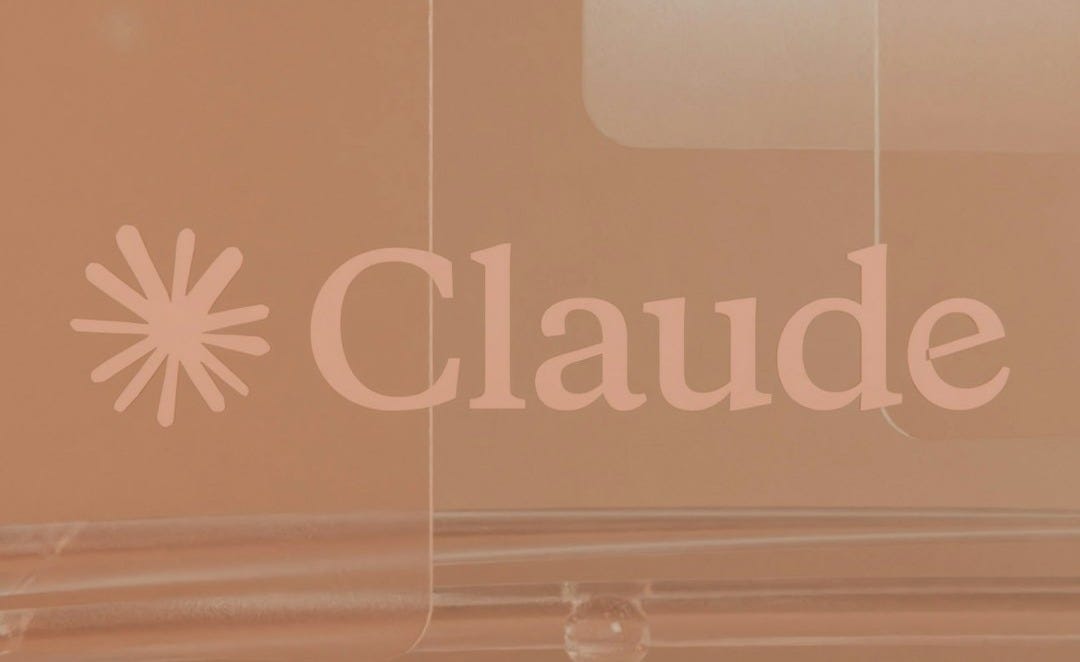Claude logo on a light brown background with reflective surfaces.