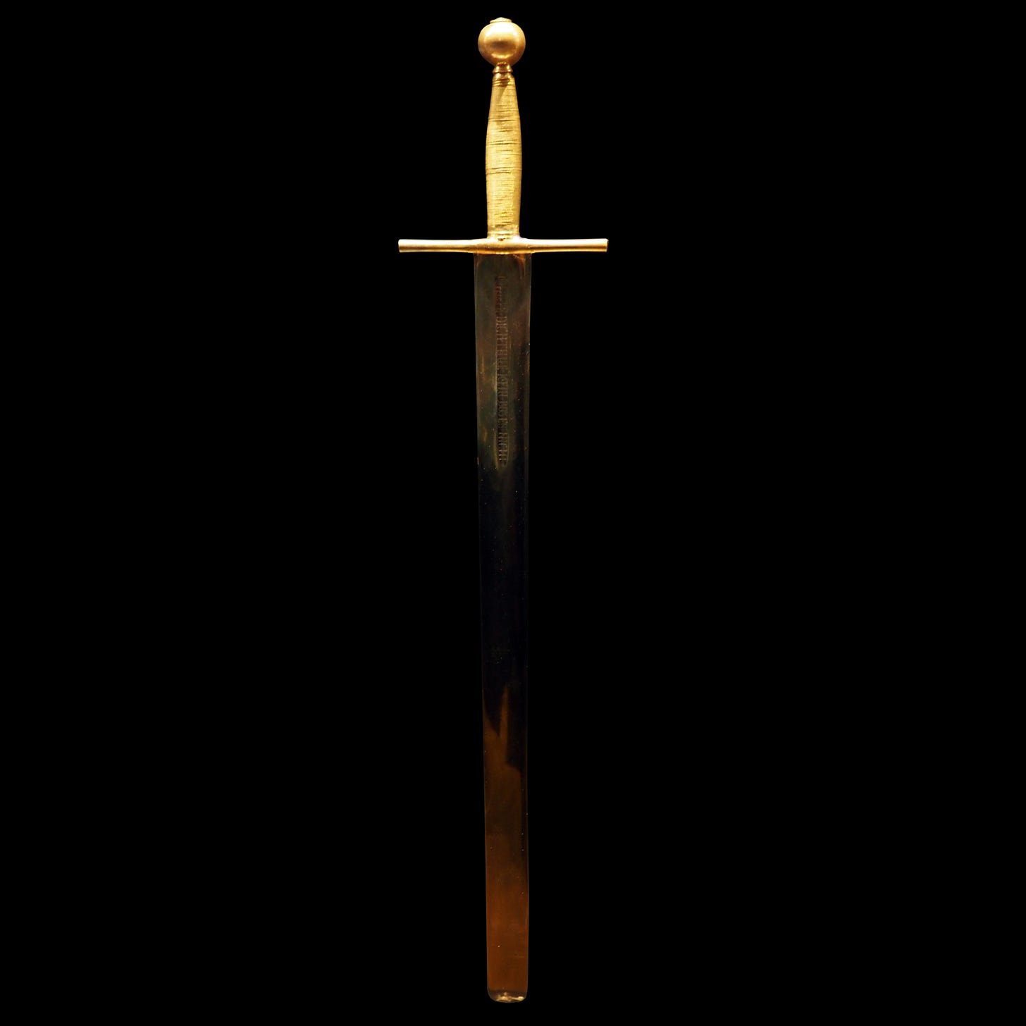 Sword of Justice with a gold-colored hilt against a black background.