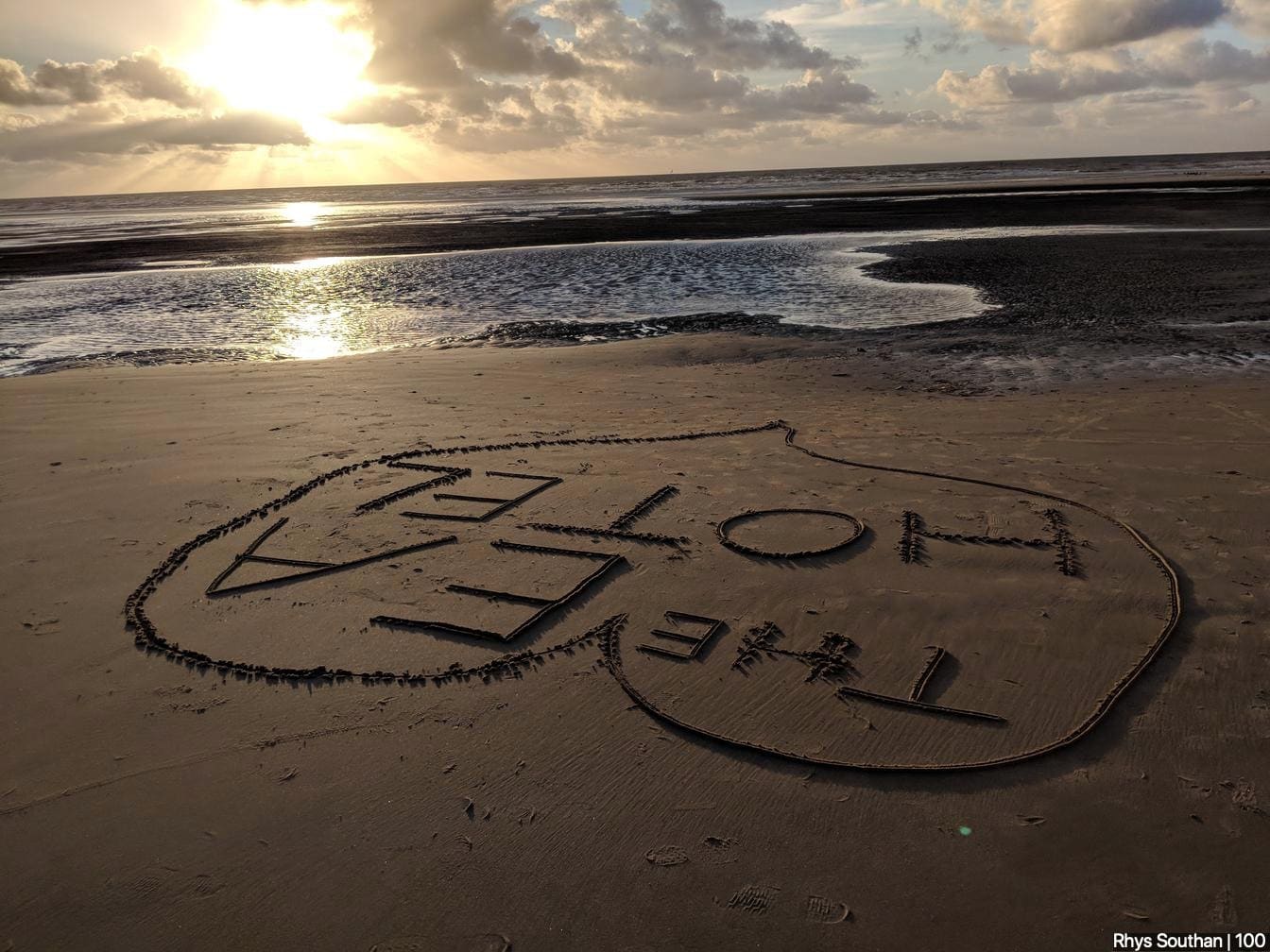 "The EA hotel" written in the sand on Blackpool beach