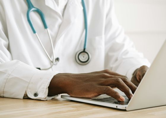 GP using laptop