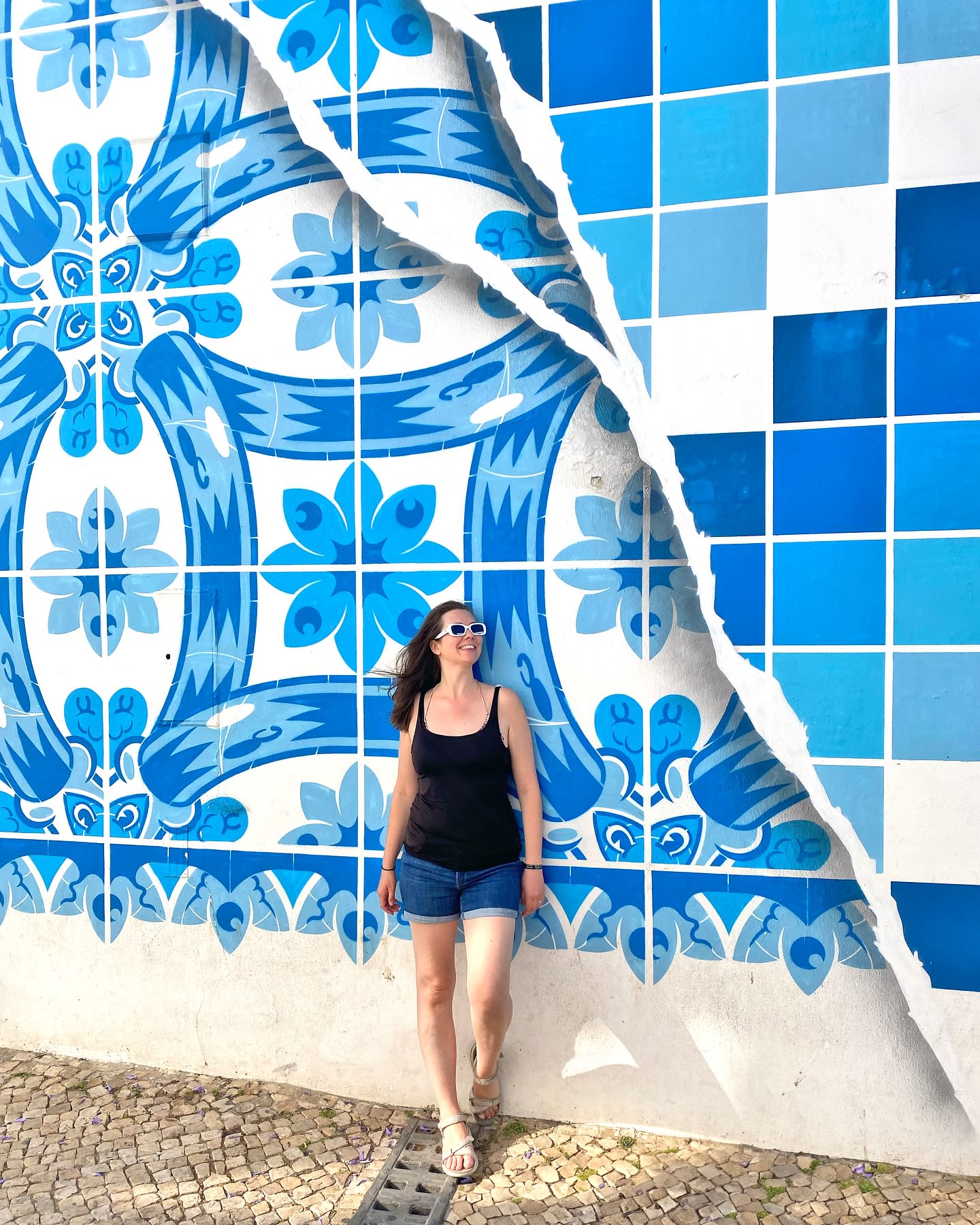 Blue and white azulejo tiles are a fixture of culture and design in many parts of Portugal. Azulejo tiles in Portugal can range from repeating geometric patterns depicting saints or historical events to full spread murals made of hundreds of tiles, similar to a mosaic. This wall of azulejo tiles can be found in the old town of Lagos, Portugal. 

Blue Wall Address 💙
R. Silva Lopes 30, 8600-315 Lagos, Portugal

Save this post for the address of this fabulous wall for your trip to Lagos, Portugal! If you’re curious to learn more about Lagos, check out the link in my bio @deanna_troy_travels for a fun-filled vlog of the best beaches and party locations! Follow this page for more Europe travel tips all summer! 🇵🇹☀️
•
•
•
@capture_portugal #capture_portugal @visitportugal #visitportugal @lagos.algarve.portugal #lagosalgarveportugal @portal_algarve #portal_algarve #Super_Algarve #Algarve @super_algarve #azulejotiles #portugal #lagosportugal #ilovealgarve #oldtownlagos #europe #instaeurope #europedestinations #portugal #lagos #algarve #girlsabroad #travelgirlshub  #shetravelz #womentravelpicture #girlswithjetlag #thegirltribe #azulejo