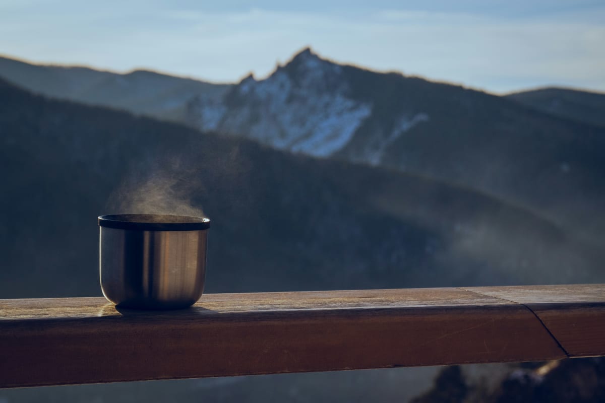 Cup of tea overlooking the mountains at camp