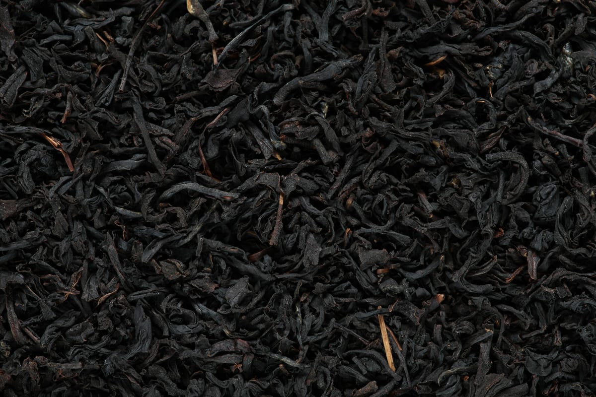 Close-up of dry black loose leaf tea, the best kind to brew in a drip coffee maker