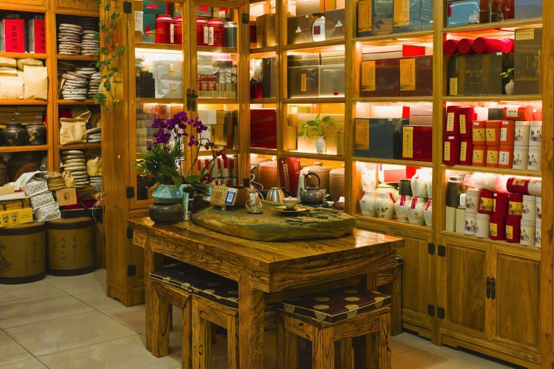 Shelves of tea tins and tea sets, ideas for a home tea station