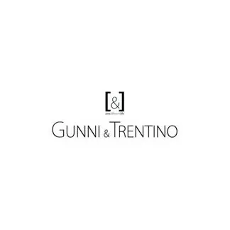 Logotipo de Gunni & Trentino en blanco sobre fondo negro