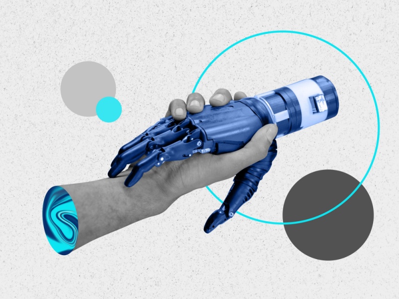 Um aperto de mão, sendo uma mão humana e outra de um robot