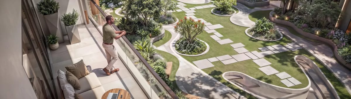 Quiet central courtyard garden offering shaded seating, manicured trees, and tranquility