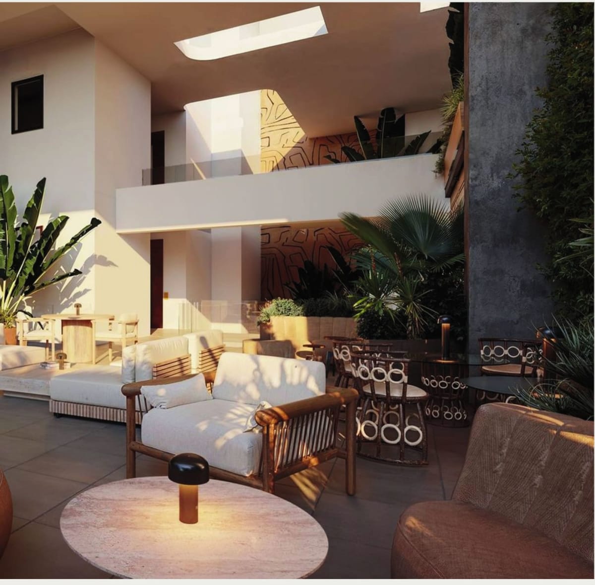 Open-air central atrium bringing natural ventilation and greenery throughout the core