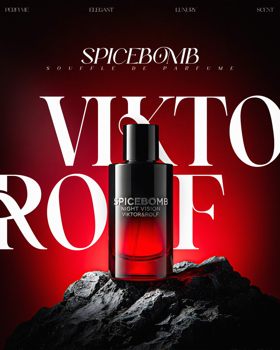 A bold poster for Spicebomb Night Vision by Viktor&Rolf, featuring the dark perfume bottle sitting on a rugged black rock against a vibrant red gradient background with large white typography.