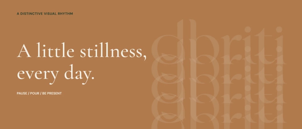 A graphic panel demonstrating the Dhriti visual rhythm, featuring light cream text "A little stillness, every day." on a Copper background, accompanied by a subtle, repeating watermark of the Dhriti logo.