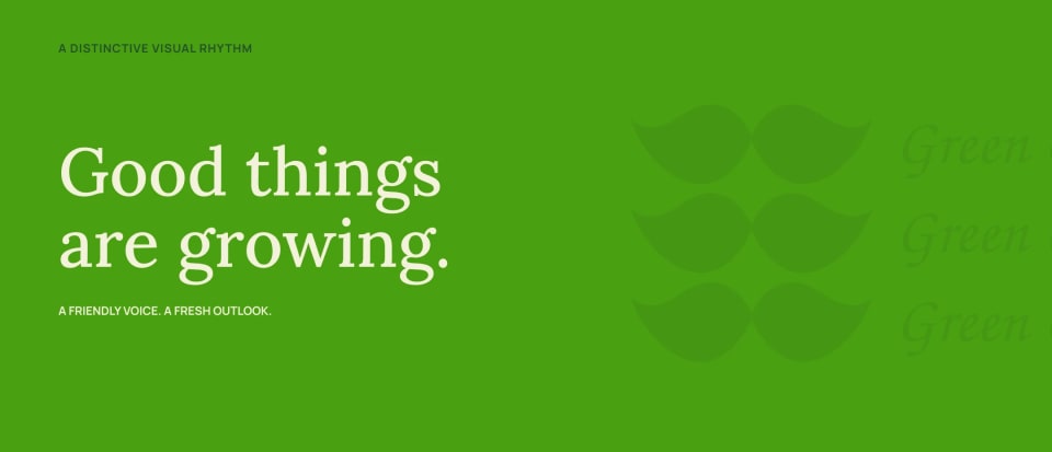A graphic panel demonstrating the Green Guru visual rhythm, featuring the Oat-colored text "Good things are growing." on a bright Leaf green background, accompanied by a subtle, repeating leaf-moustache graphic pattern.