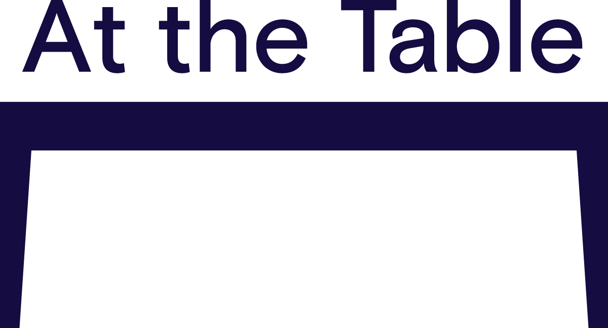 Logo for "AT THE TABLE INC"
