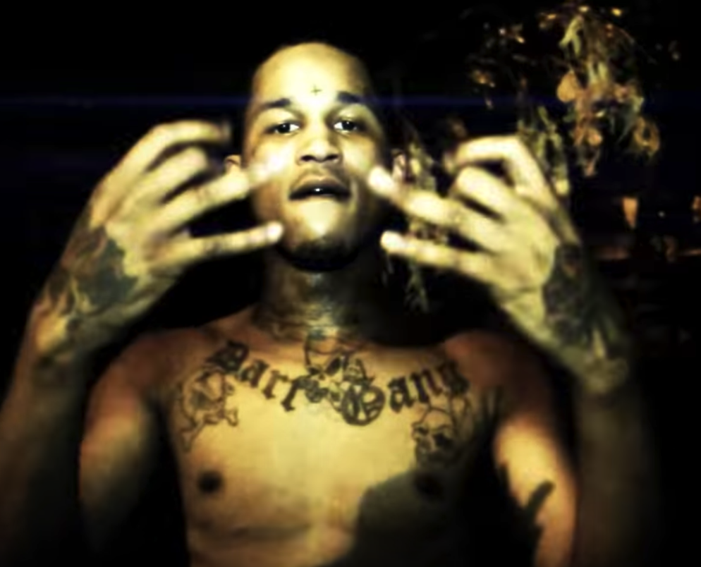 Rapper Fredo Santana showing gang signs.