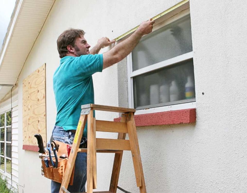 Man measuring standard window size