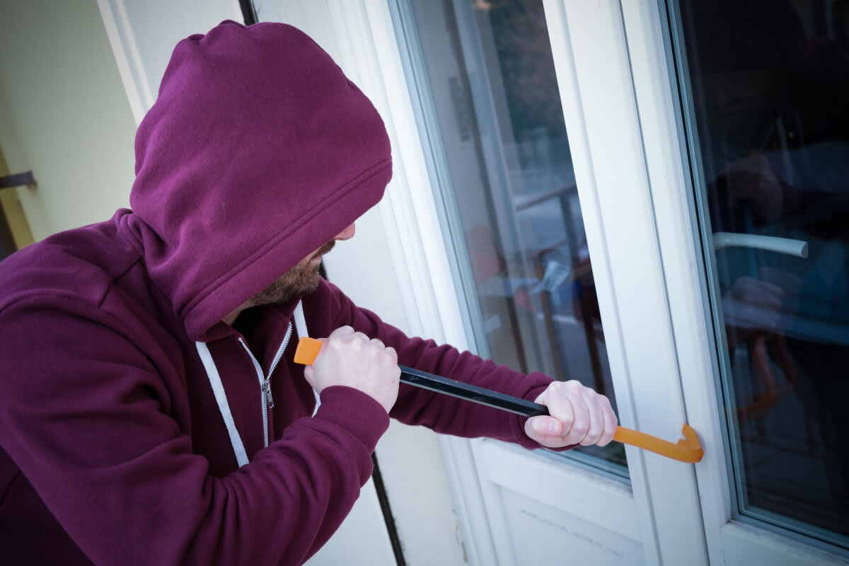 burglar breaking into home
