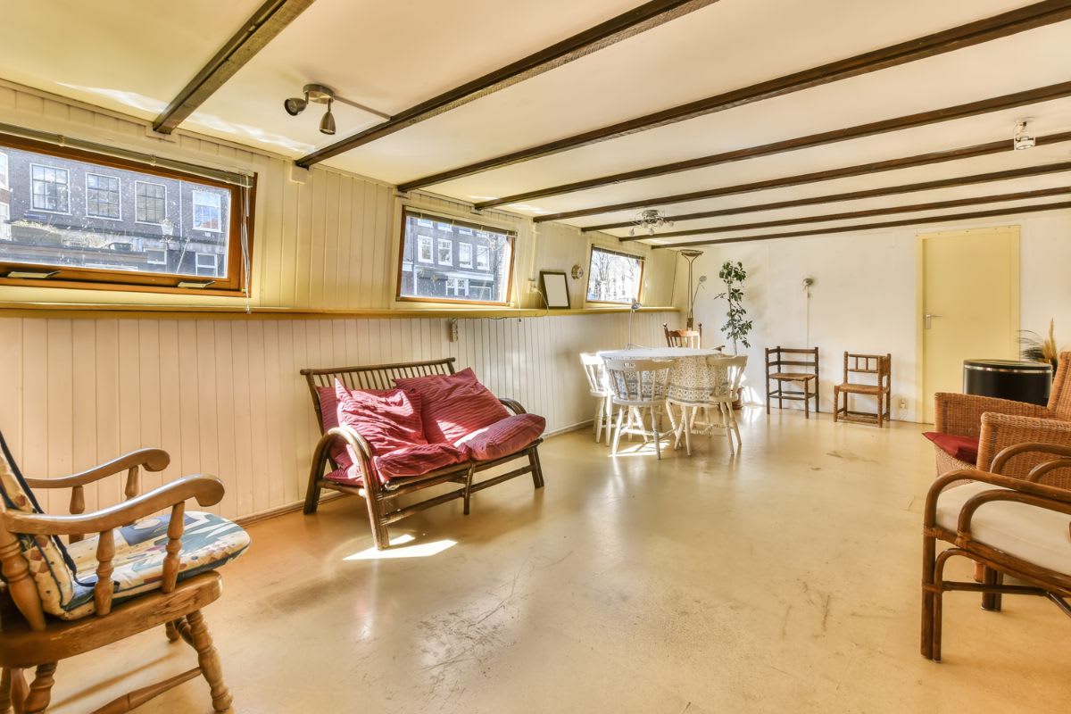 a-living-room-with-furniture-and-a-dining-room