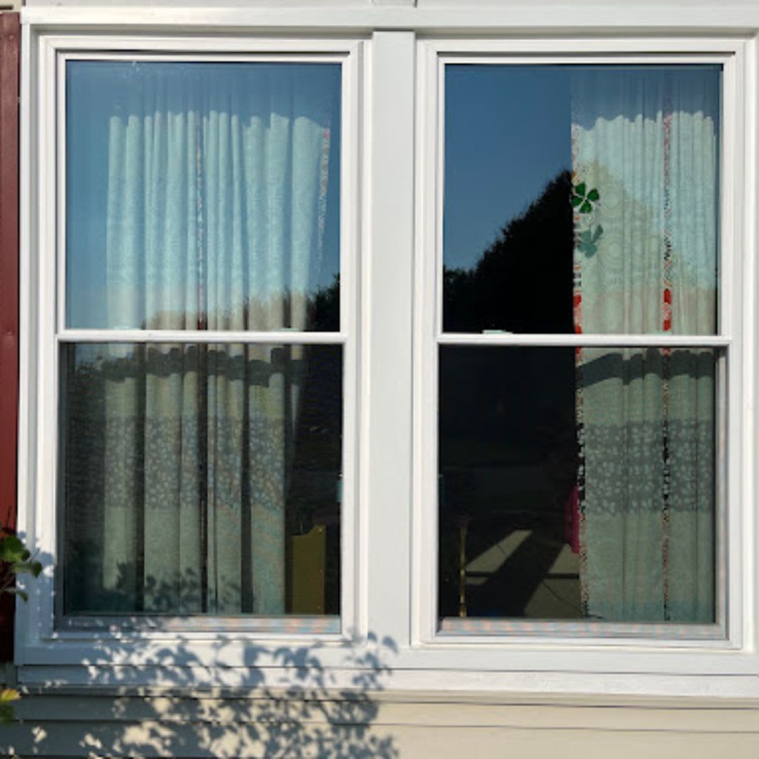 A white window with curtains.