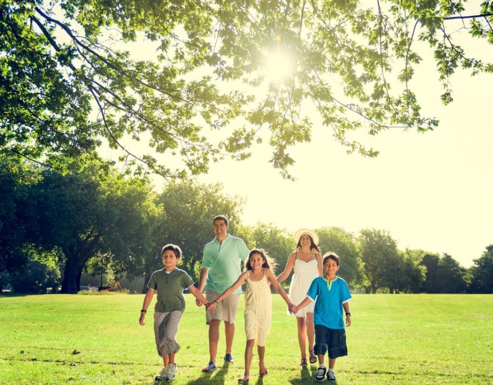 Family walking through park