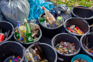Plastic buckets containing items for recycling