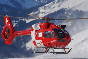Rega helicopter landing in the mountains