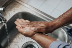 Hands being washed with soap