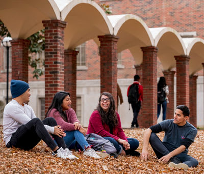 4 students outdoors on the CBU campus