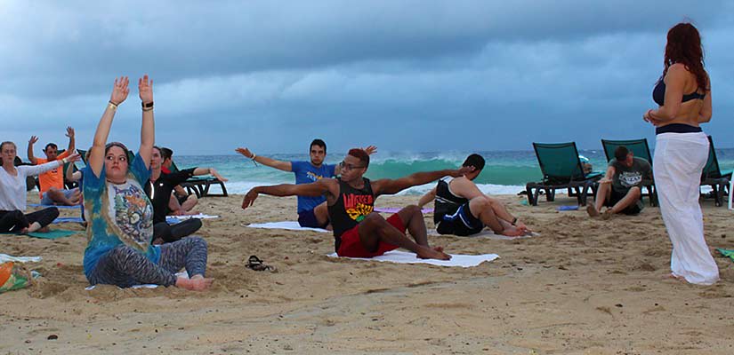 Students exercising on the beach