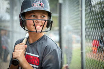 A softball player in the batter's box