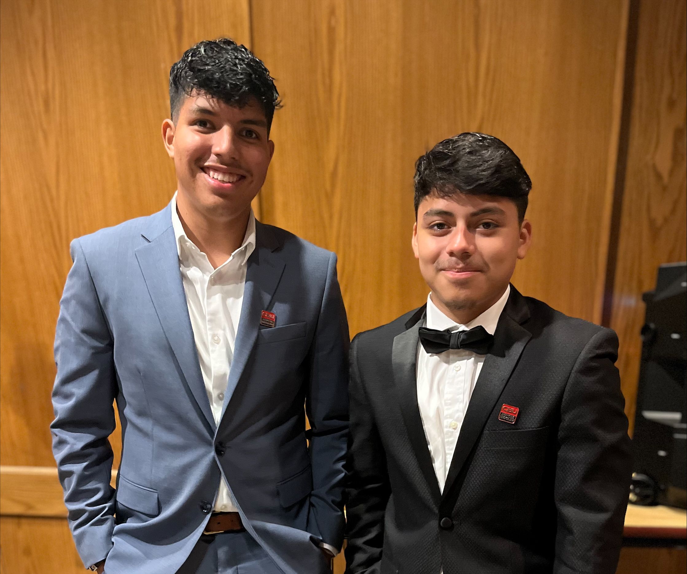 Two honors program students dressed up for an event.