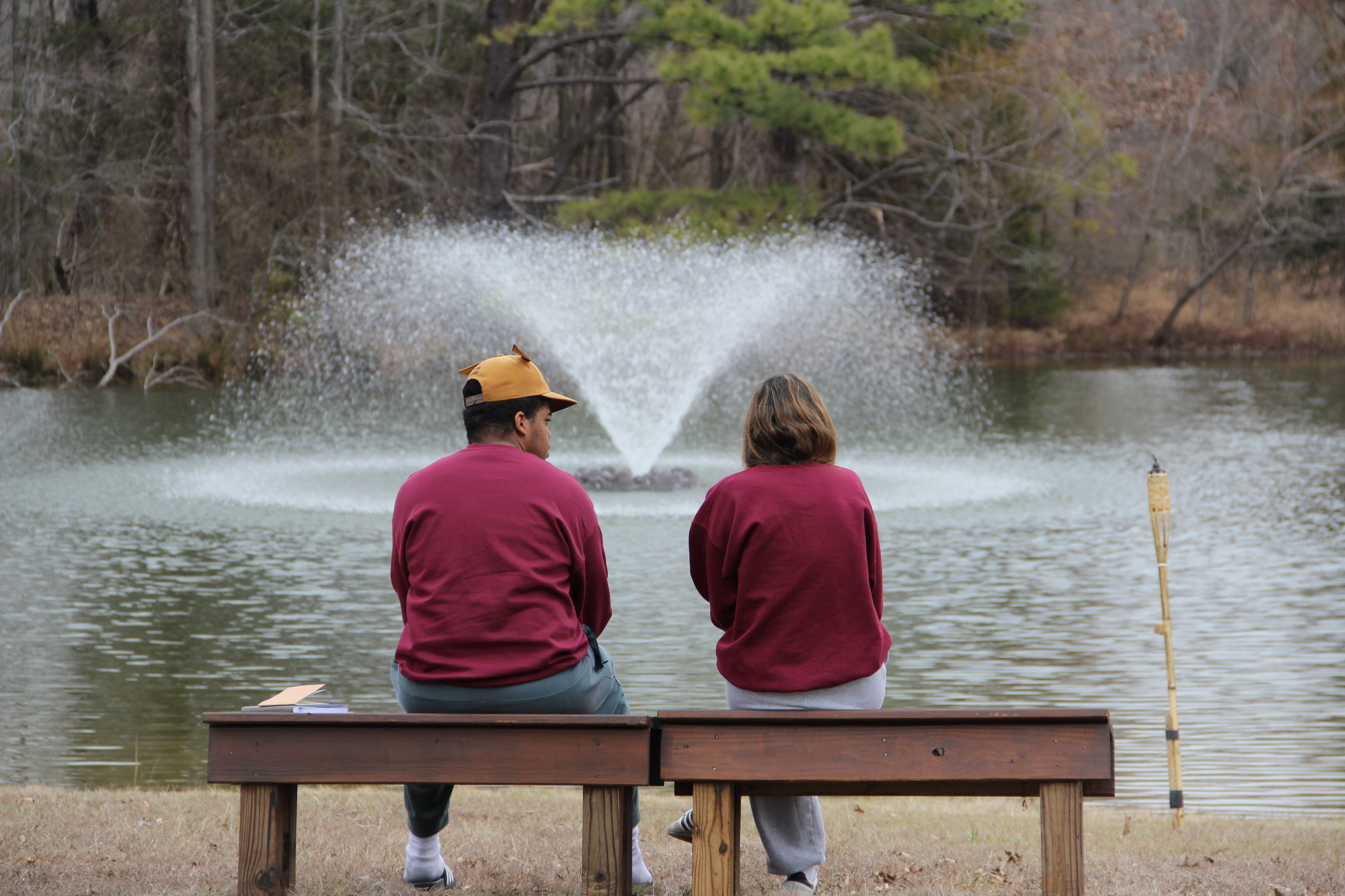 Retreat Image two people in front of water feature