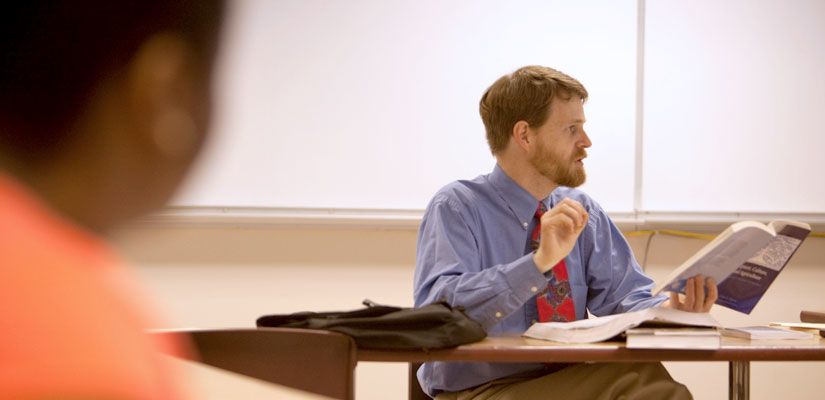 Faculty teaching religion class