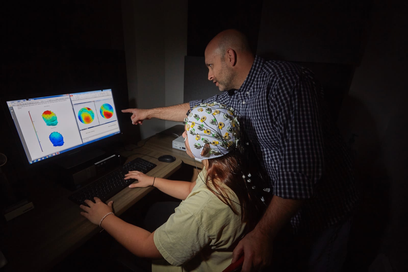 CBU Teacher with student, studying brain waves
