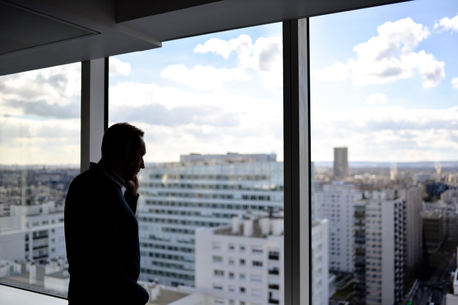 Man Looking out of Window