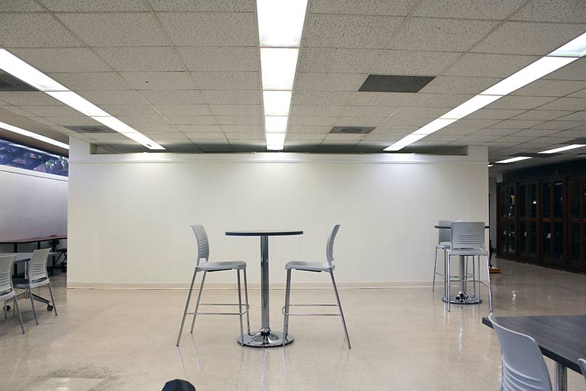 high table with two high chairs in the foyer of the Beverly and Sam Ross Gallery