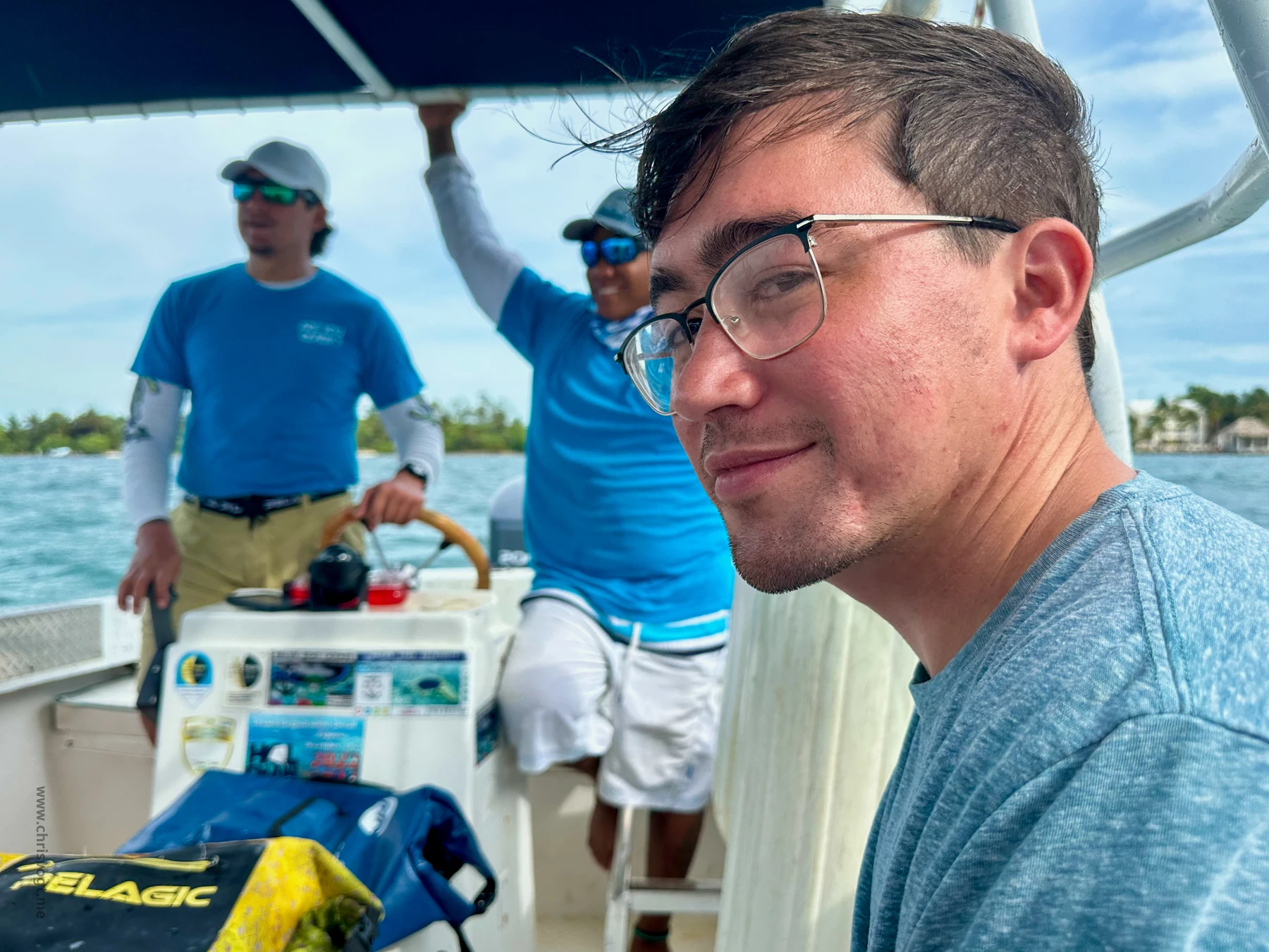 Nick smirking as we ride out to swim with sharks in Shark Ray Alley.