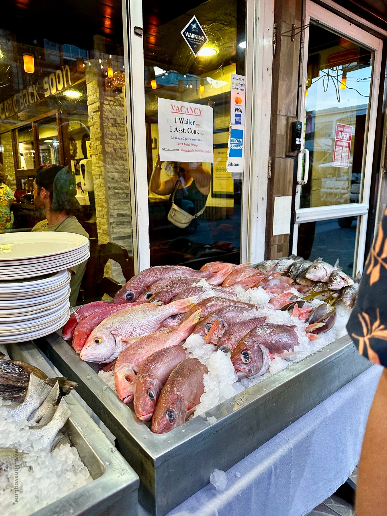The entrance to Caramba Restaurant, with fresh-caught red snapper on display. Pick the one you want them to cook.