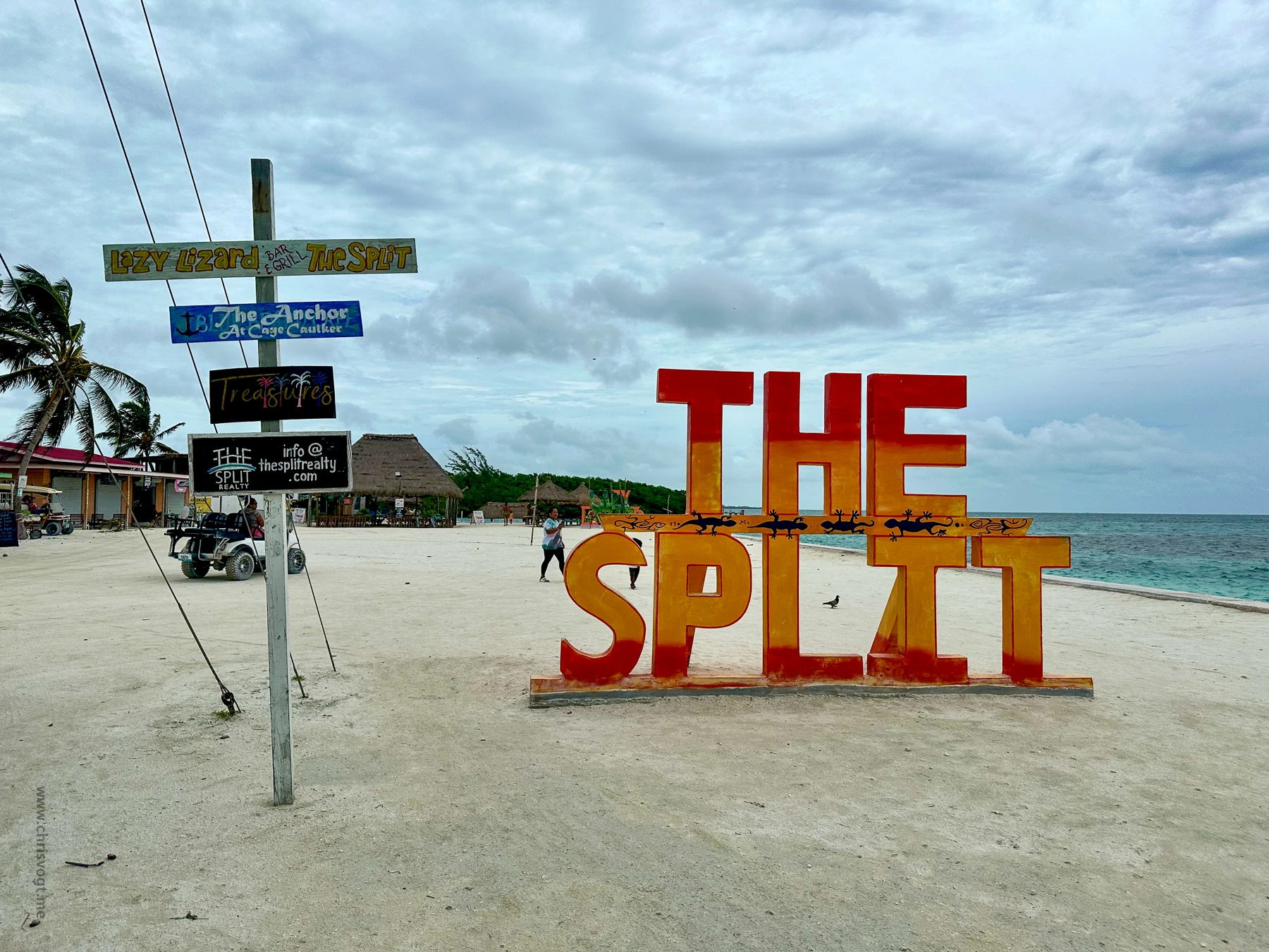 The Split and signs for the Lazy Lizard Bar and Grill in Caye Caulker, Belize.