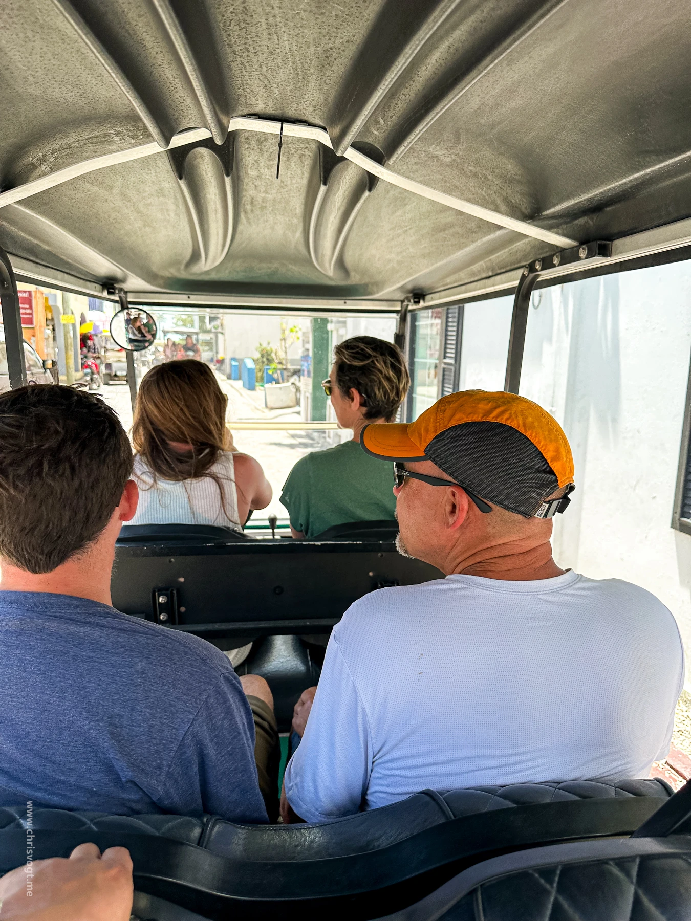 Navigating the streets of San Pedro in a 3-row golf cart