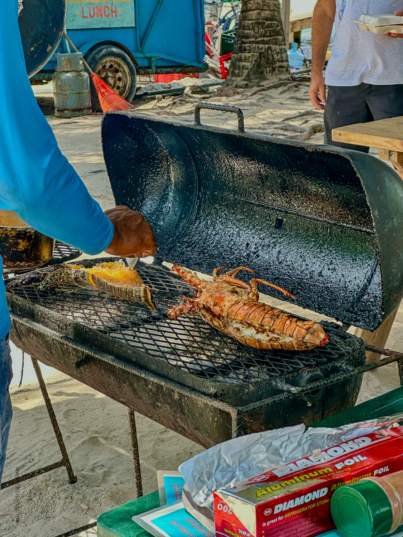 Lobster on the grill at Betty’s Go Slow Grill in Caye Caulker, Belize.