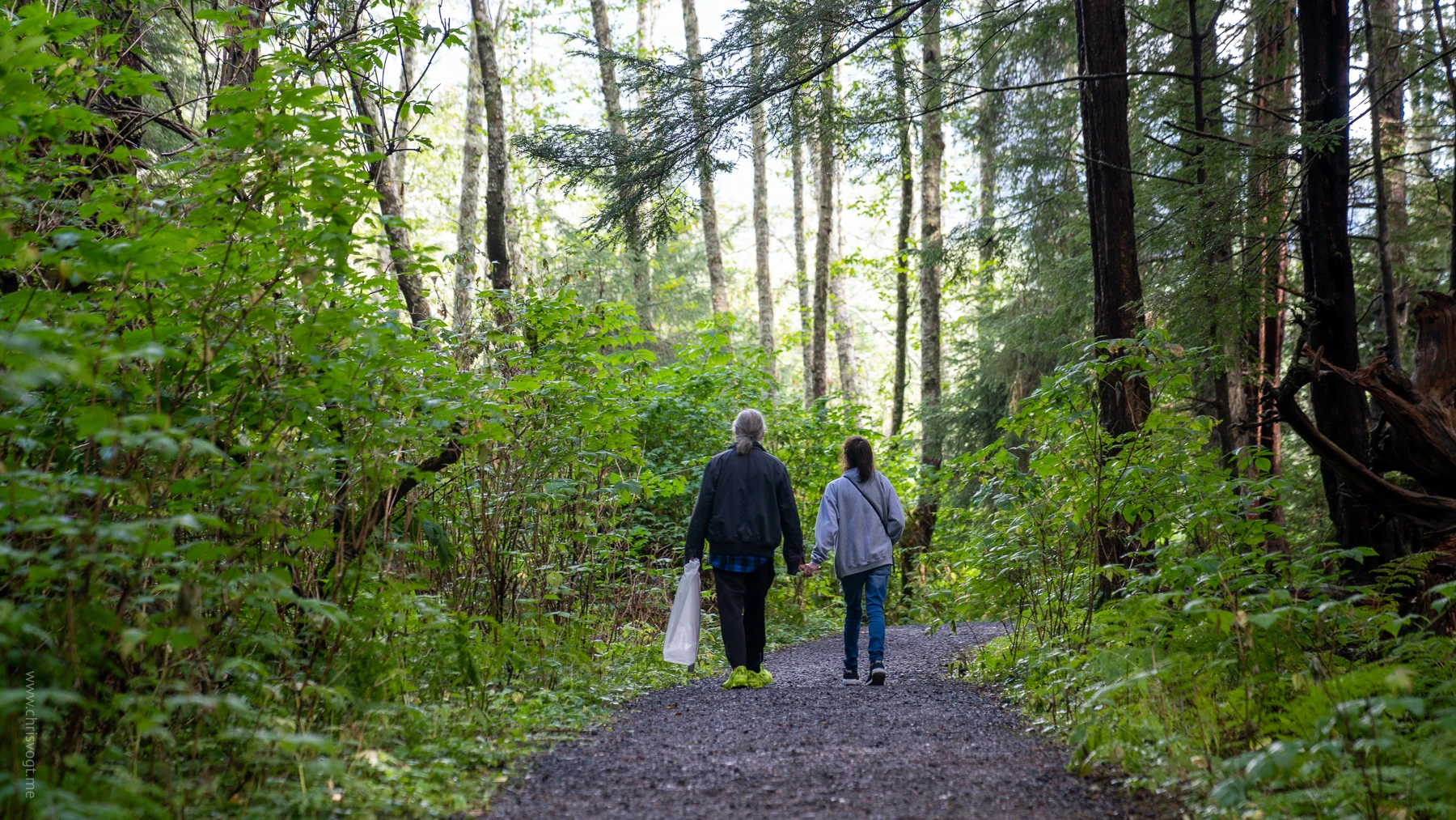 Dad and Diane walking on the Sitka Totem Trail