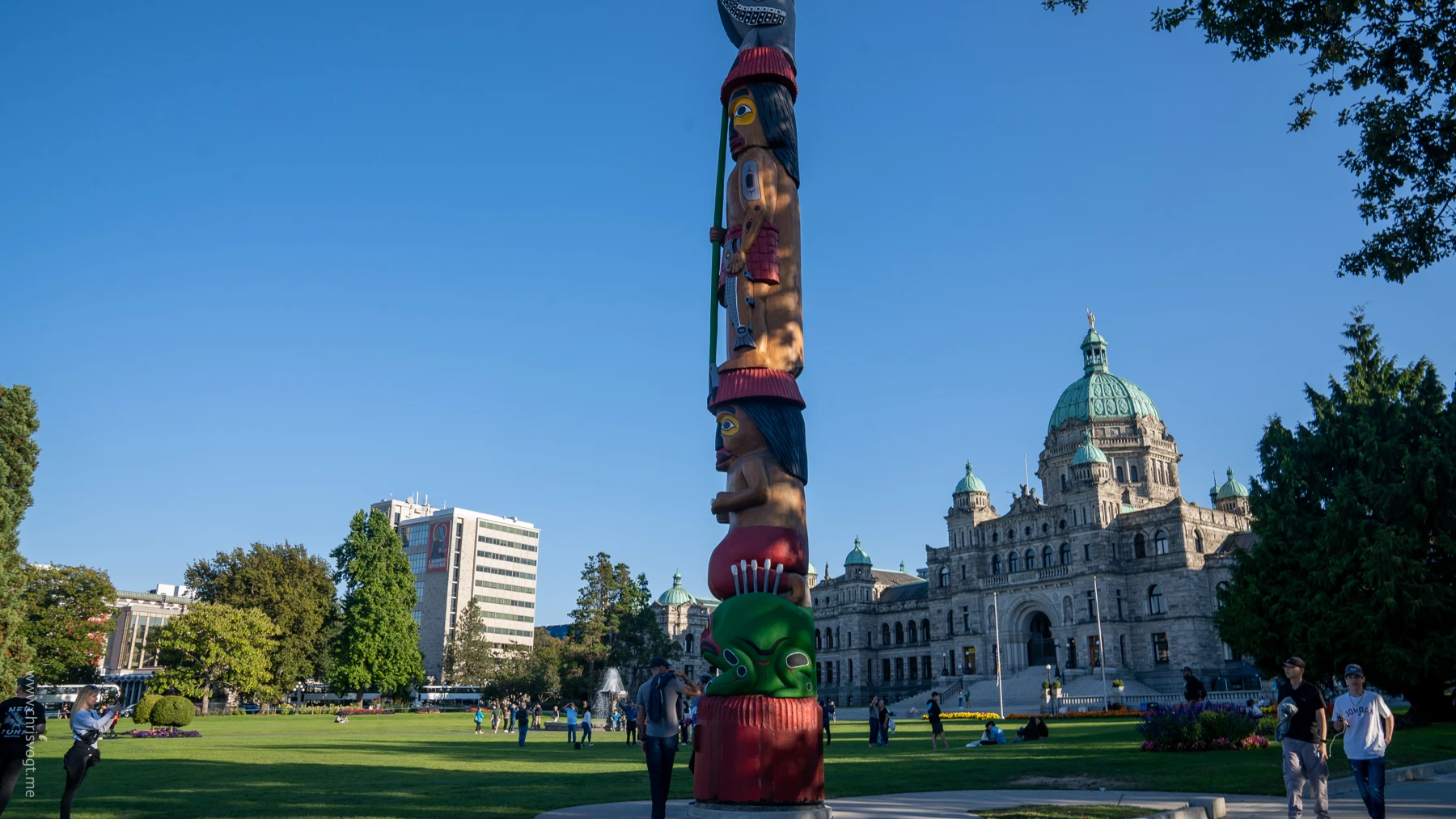A totem in front of the British Columbia Parliament Building in Victoria, Canada